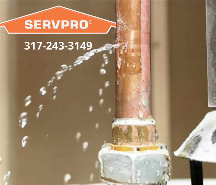This picture shows a pipe leaking water with the SERVPRO logo and our phone number.